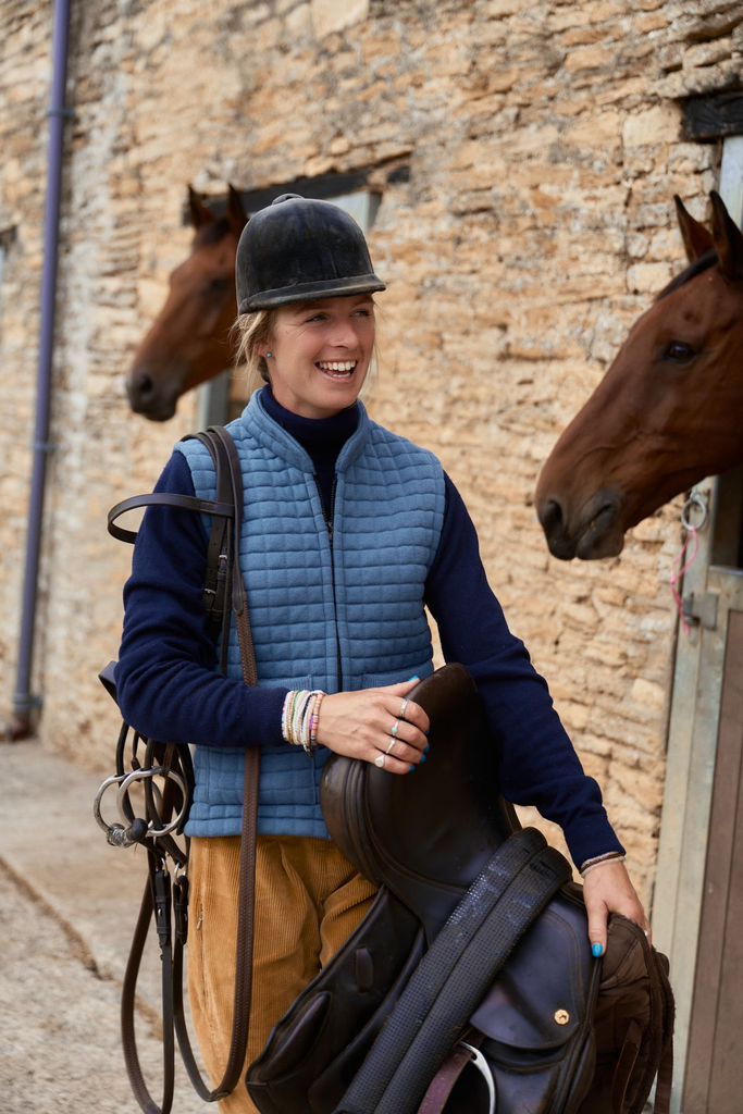 Ladies Gilet Mediterranean - carrying saddle at stables (Steph 32376).webp